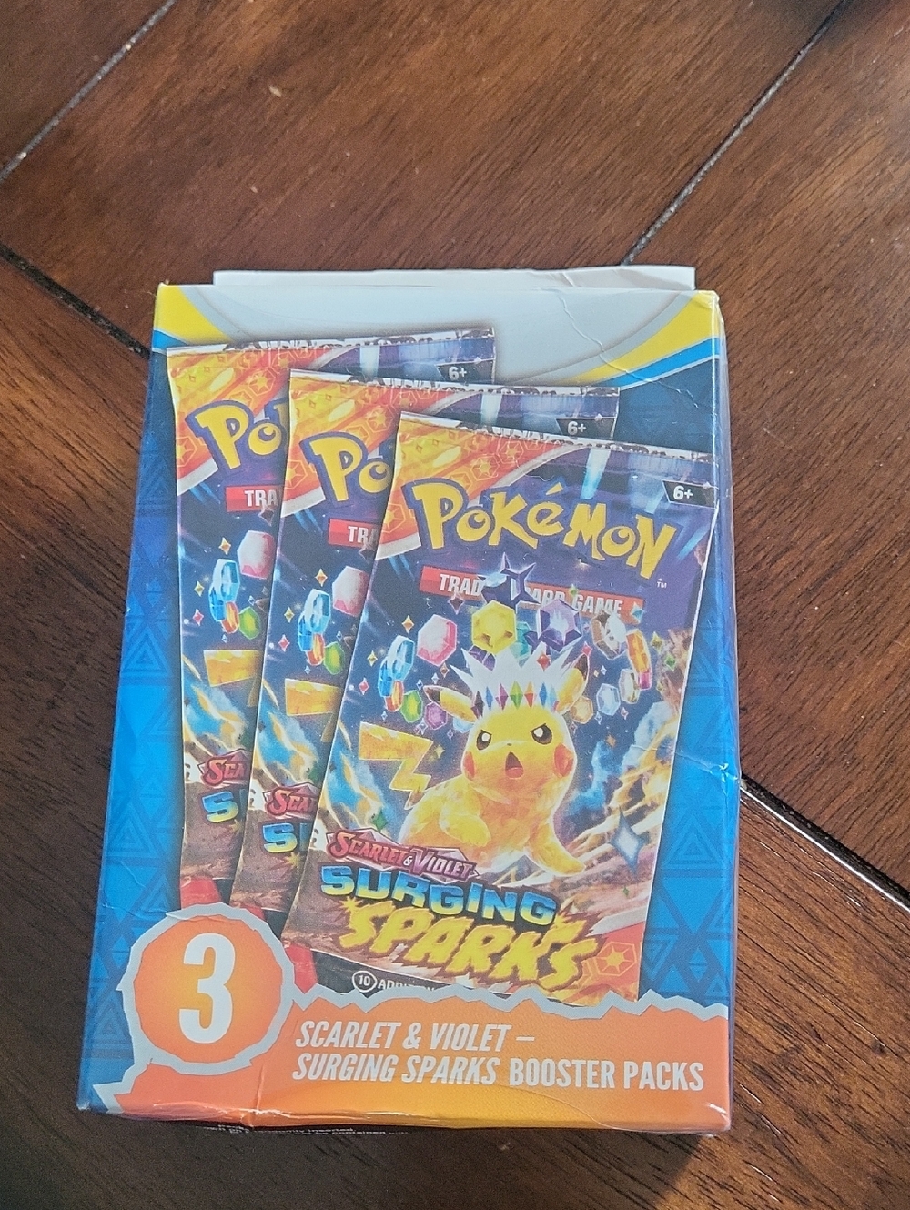 Scarlet & Violet Surging Sparks Booster Pack (3-Pack) - Yellow